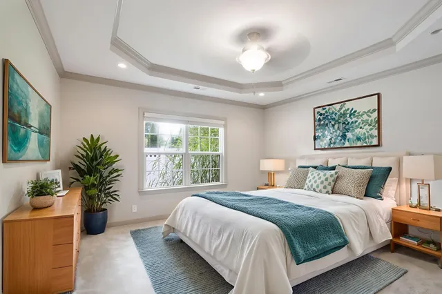 a bedroom with a large bed and a large window