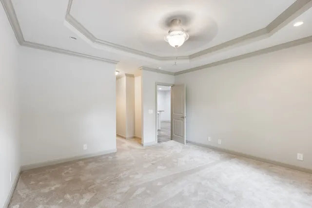 an empty room with a empty space and a ceiling fan