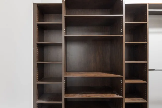 a view of walk in closet with racks