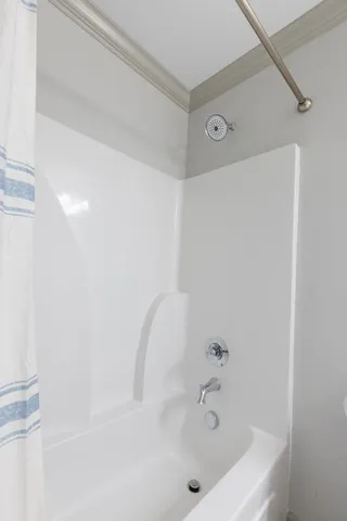 a bathroom with a white bath tub
