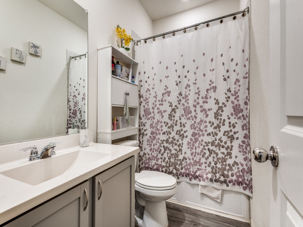 302 Pepperbark Avenue Princeton, TX 75407 - Photo 7 of 12 a bathroom with a sink and a toilet