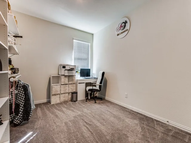 a view of a workspace with furniture