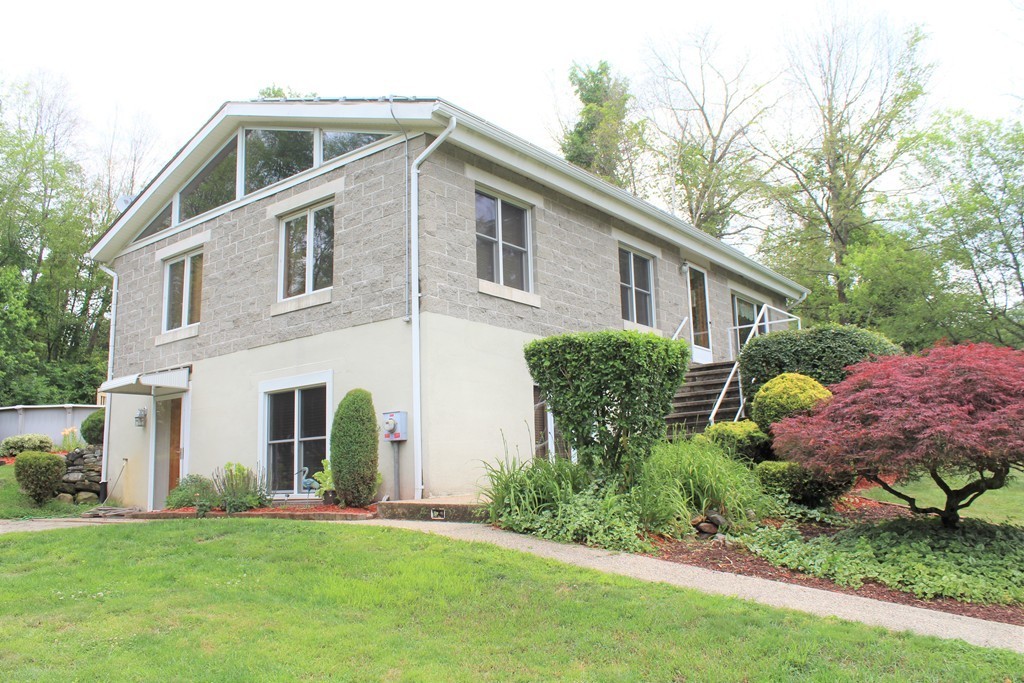 121 Wilbraham Road Monson, MA 01057 - Photo 3 of 30 a front view of house with yard and green space