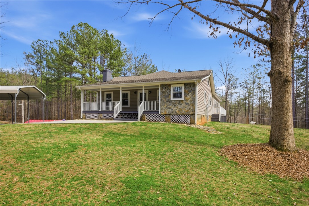 196 Flyroot Trail Pickens, SC 29671 - Photo 7 of 48 This charming home features a welcoming covered porch, perfect for enjoying the serene outdoor setting.