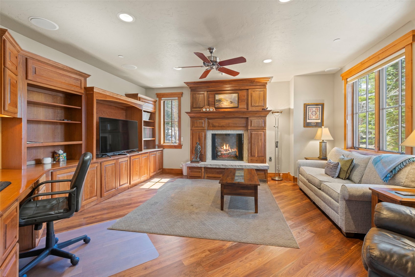 317 Timbertrail Road Breckenridge, CO 80424 - Photo 24 of 50 a living room with furniture a flat screen tv and a fireplace