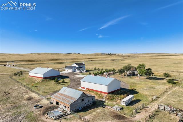 Birds eye view of property with a rural view