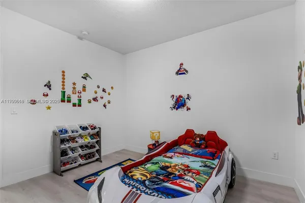 a room with toys and dresser
