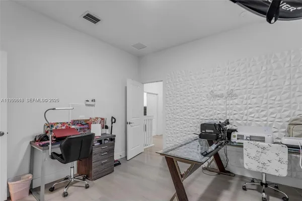 a view of a workspace with furniture