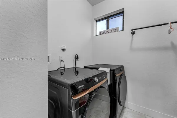 a utility room with dryer and washer