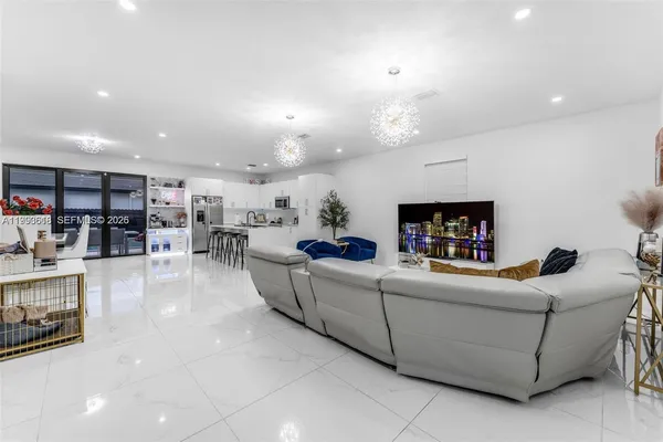 a living room with furniture and a flat screen tv