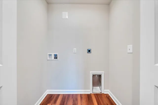a view of room with window and wooden floor