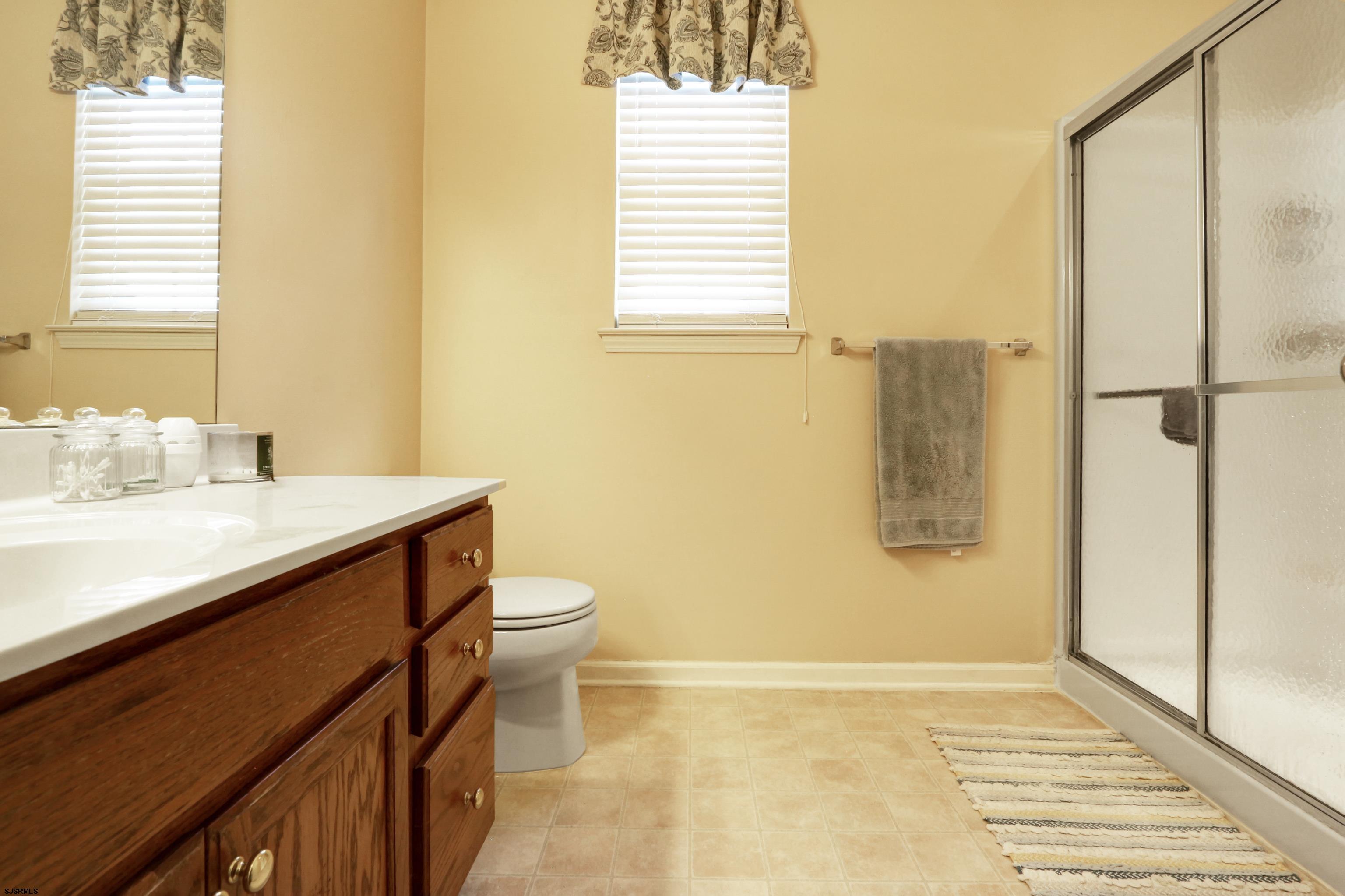 48 Gasko Road Mays Landing, NJ 08330 - Photo 15 of 30 a bathroom with a sink a toilet and shower