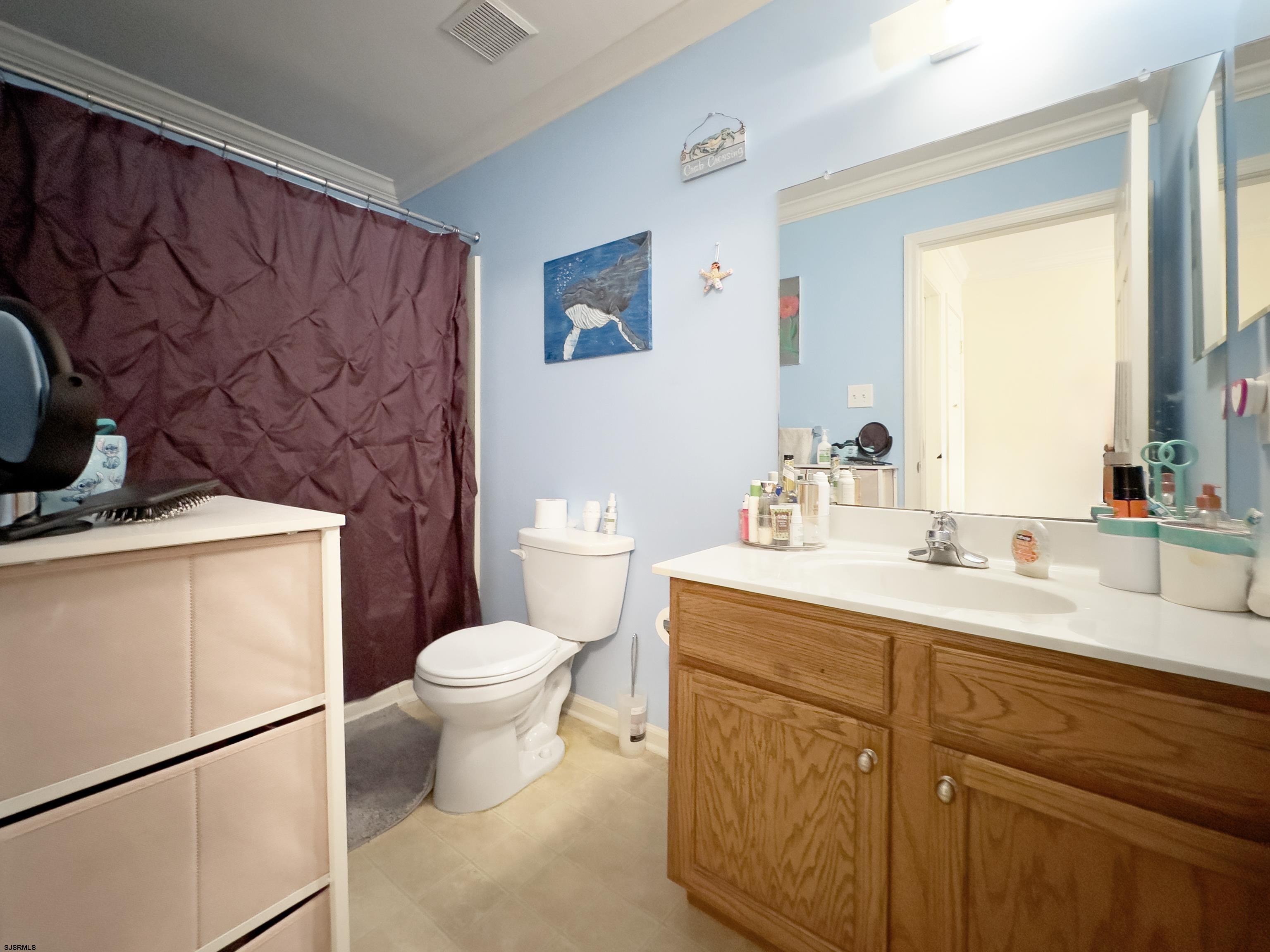 48 Gasko Road Mays Landing, NJ 08330 - Photo 18 of 30 a bathroom with a toilet sink and mirror