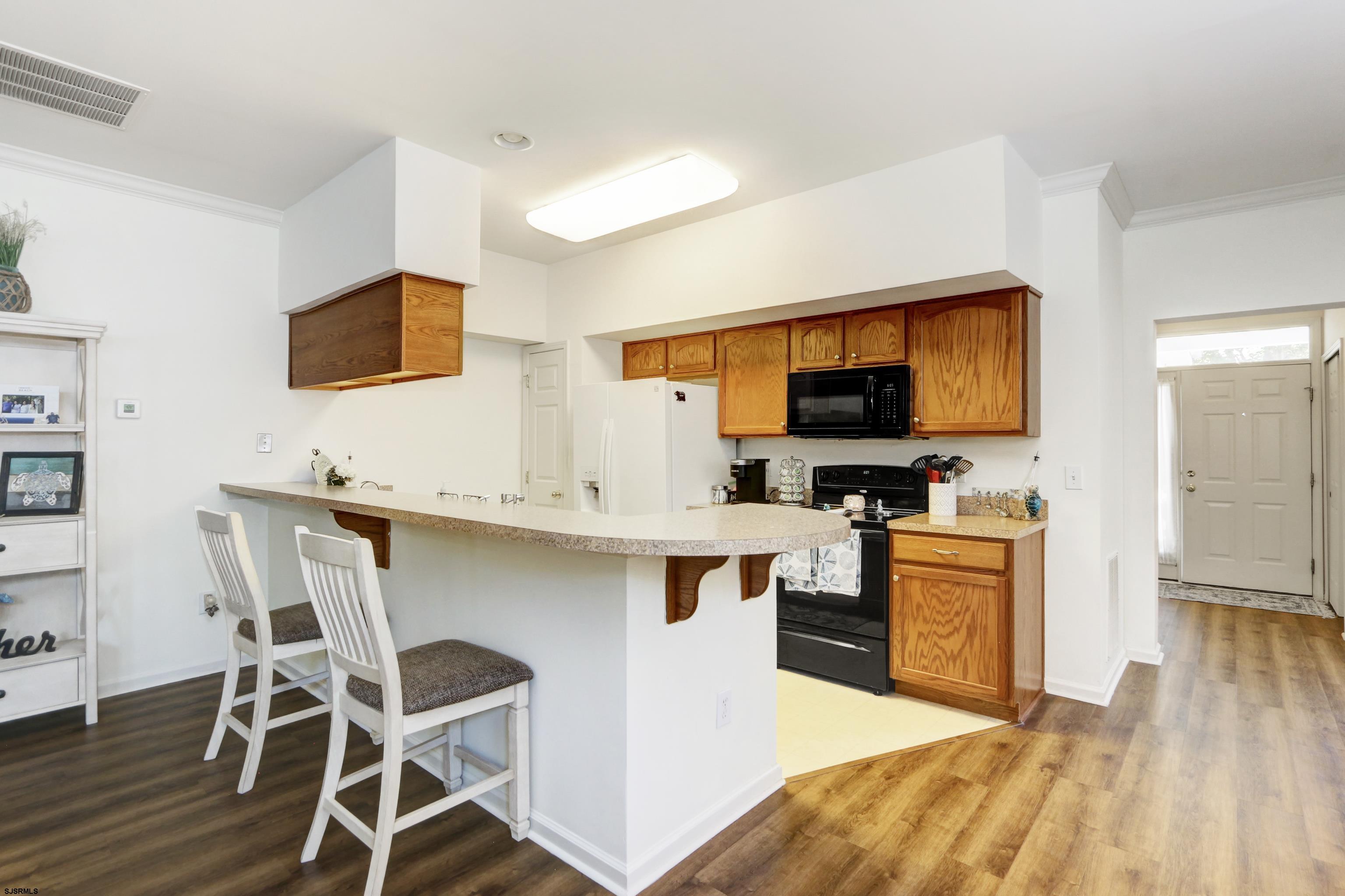 48 Gasko Road Mays Landing, NJ 08330 - Photo 6 of 30 a kitchen with stainless steel appliances kitchen island granite countertop a sink and chairs