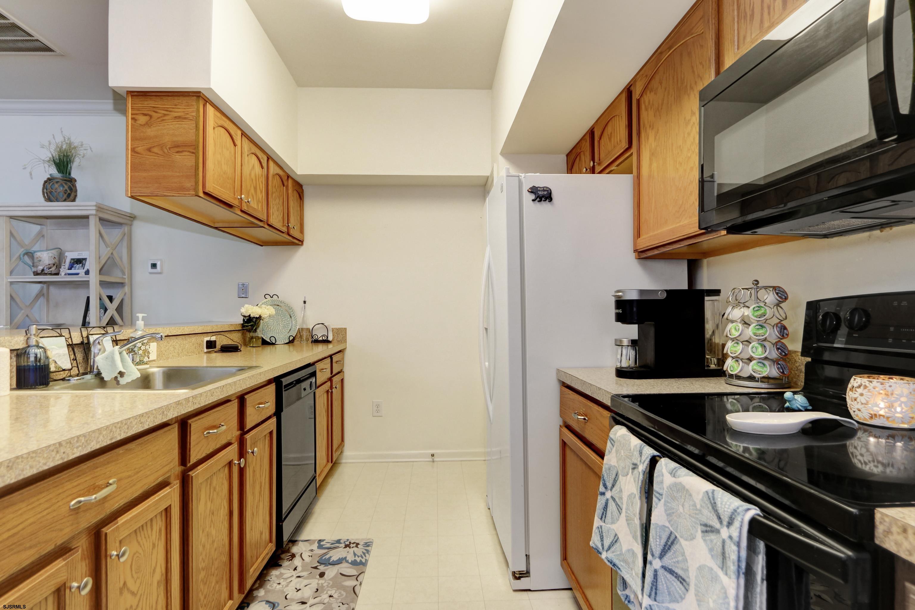 48 Gasko Road Mays Landing, NJ 08330 - Photo 7 of 30 a kitchen with stainless steel appliances a sink a stove and a microwave