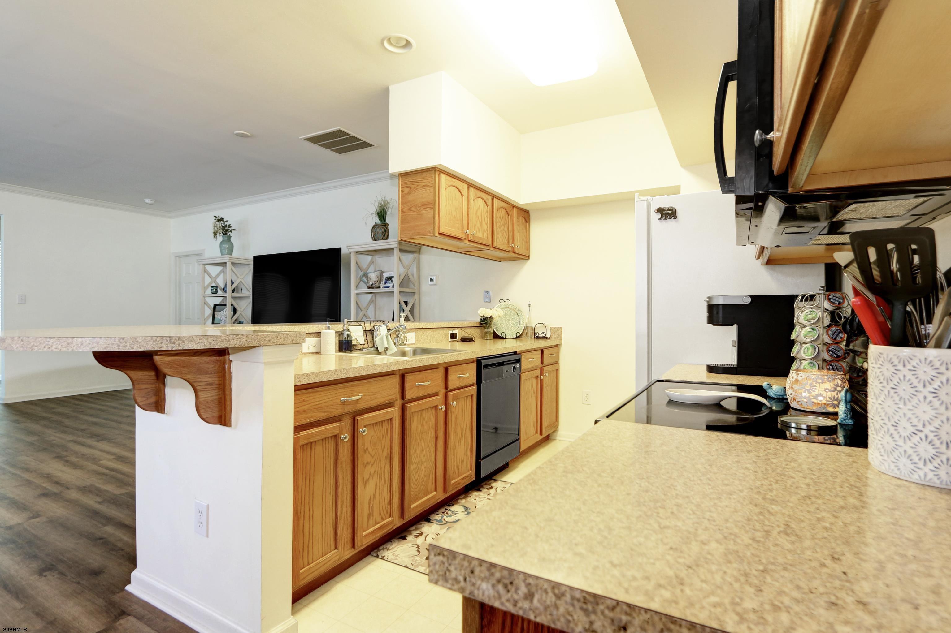 48 Gasko Road Mays Landing, NJ 08330 - Photo 8 of 30 a kitchen with stainless steel appliances kitchen island a stove a sink and a refrigerator