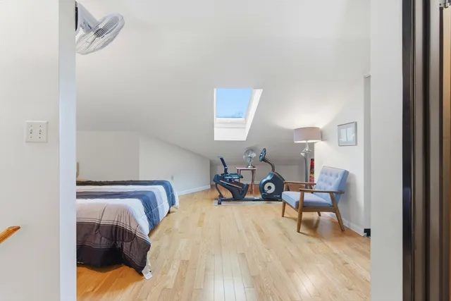 a bedroom with a bed and a mirror