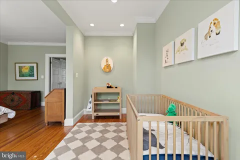 a living room with furniture a rug and a window