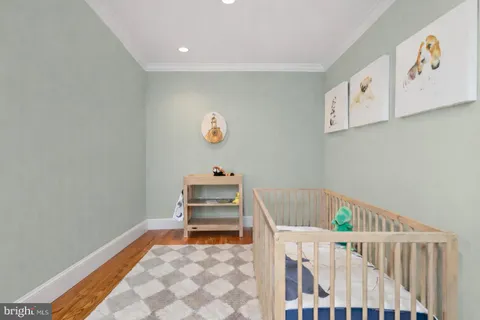 a bedroom with two beds and a large window