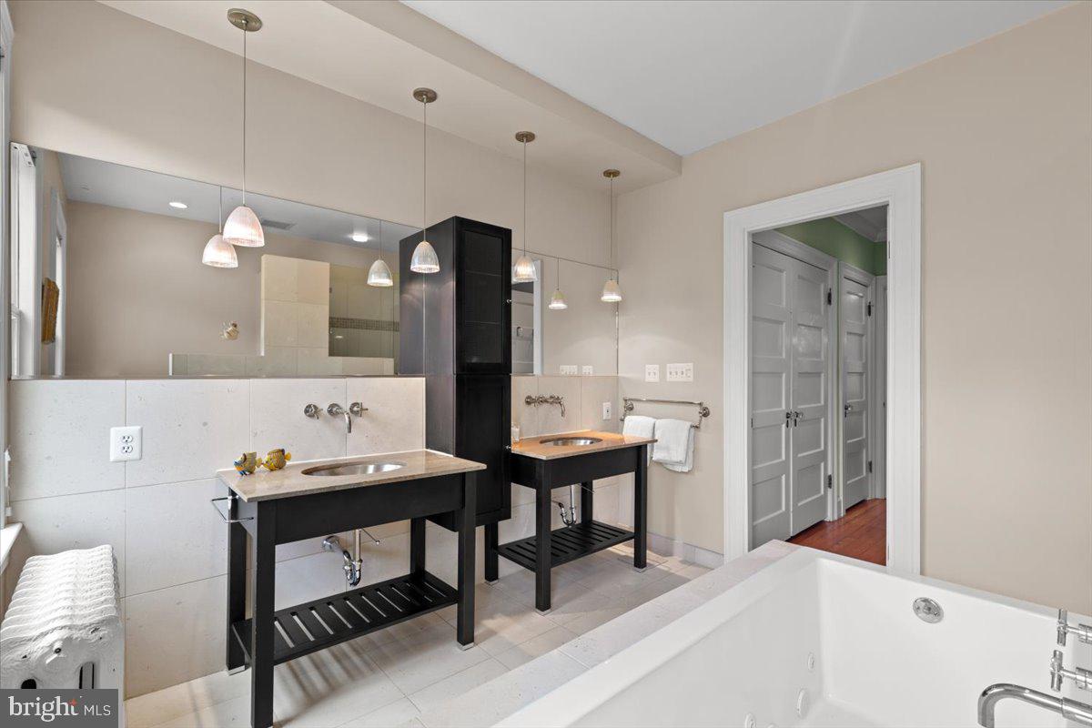 2816 27th Street Northwest Washington, DC 20008 - Photo 46 of 81 a room with a table chairs and a wooden floor