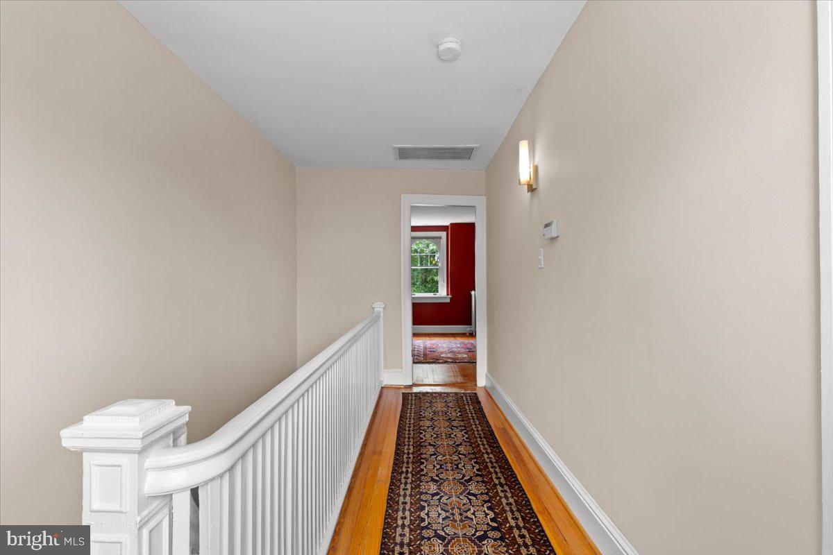 2816 27th Street Northwest Washington, DC 20008 - Photo 47 of 81 a view of a hallway with wooden floor
