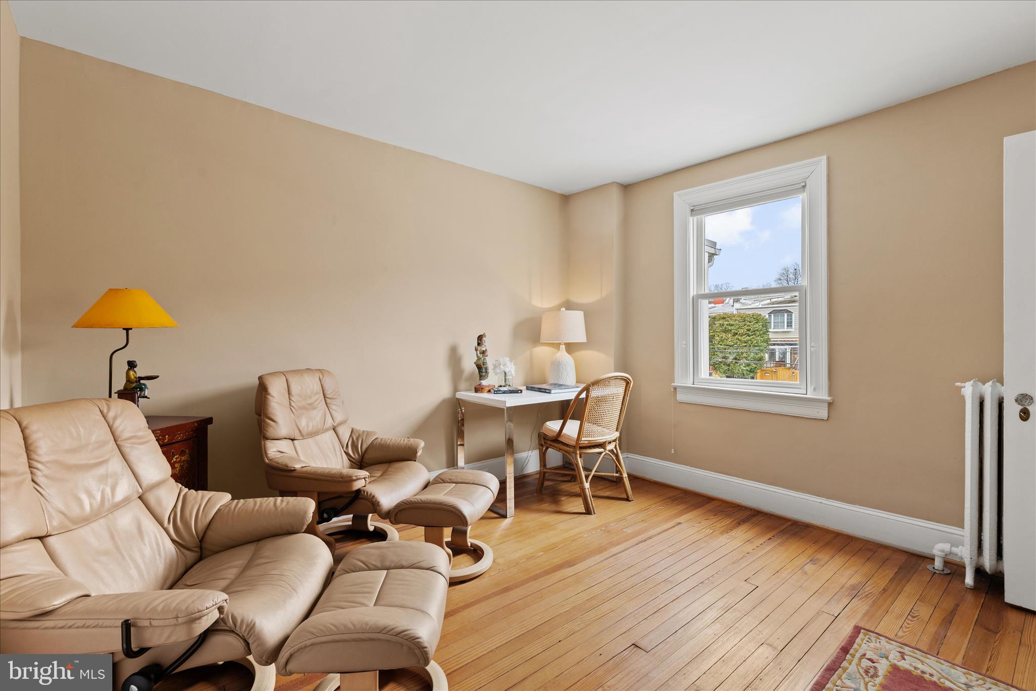 2816 27th Street Northwest Washington, DC 20008 - Photo 49 of 81 a living room with furniture a window and wooden floor