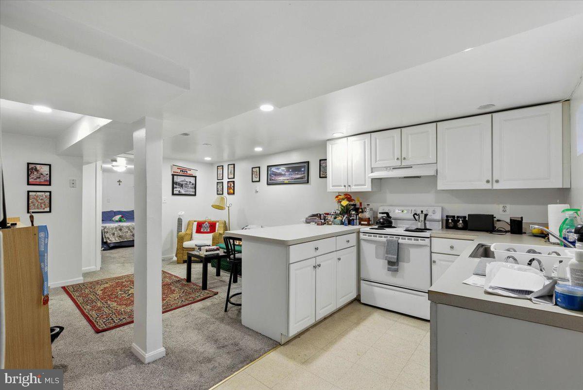 2816 27th Street Northwest Washington, DC 20008 - Photo 66 of 81 a kitchen with stainless steel appliances granite countertop a sink and cabinets