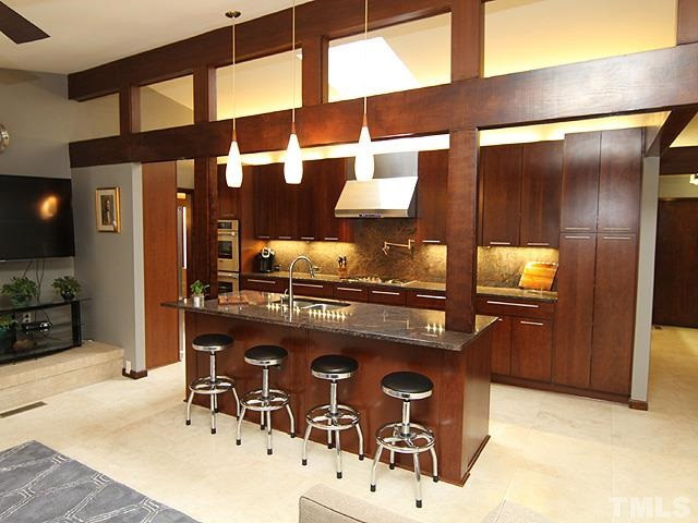 4901 Rembert Drive Raleigh, NC 27612 - Photo 7 of 25 A look into the kitchen from the family room. Kitchen