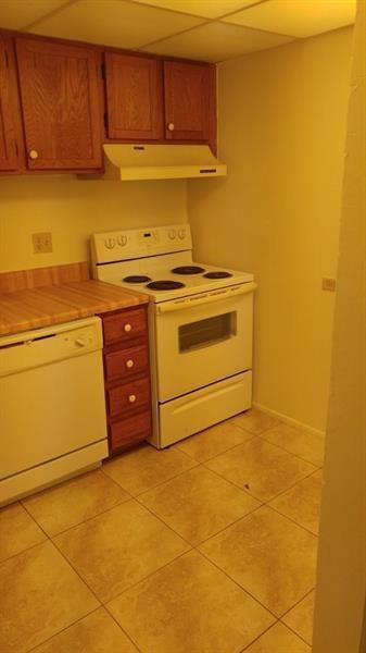3750 Inverrary Drive, Unit Z2F Lauderhill, FL 33319 - Photo 3 of 12 a kitchen with a stove and a cabinets