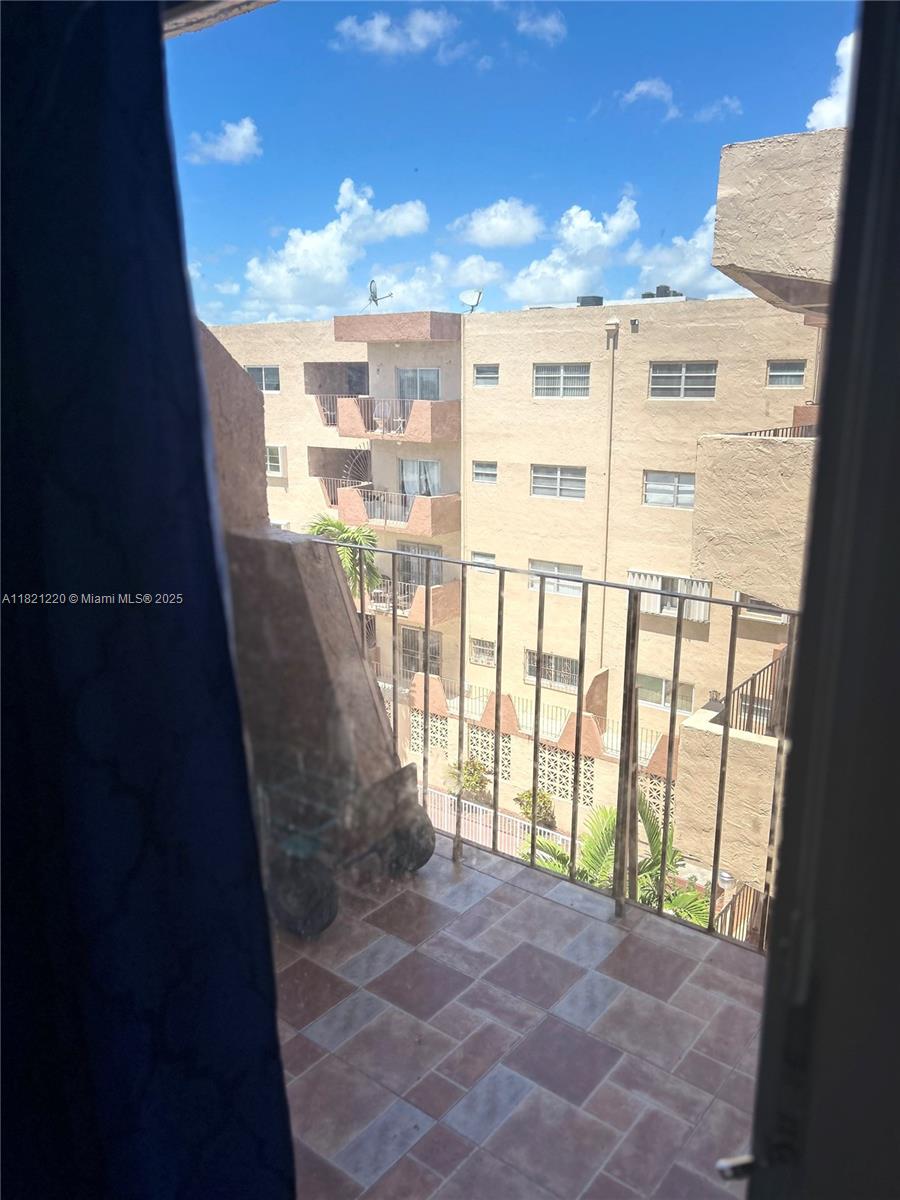 1630 West 46th Street, Unit 511C Hialeah, FL 33012 - Photo 4 of 12 a view of a large window with an outdoor space