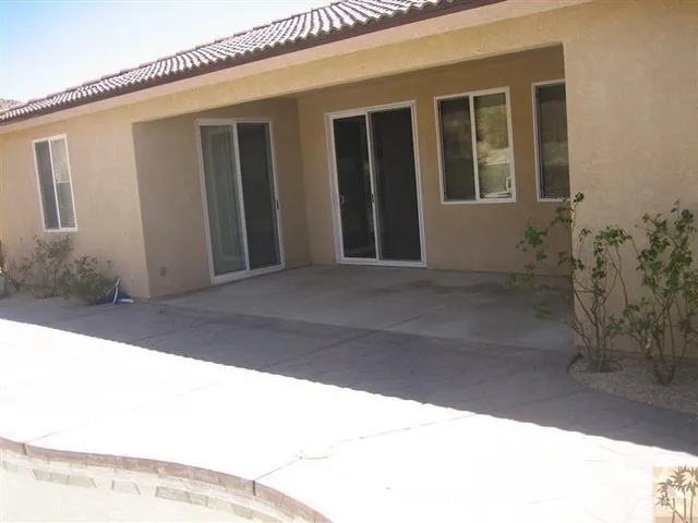 a view of backyard with porch