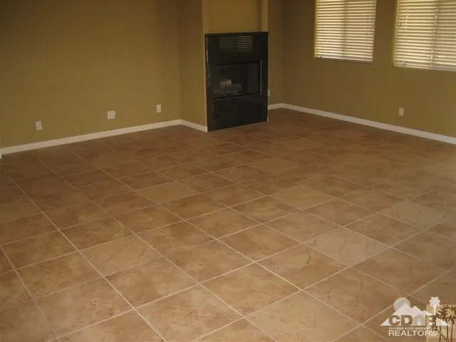 a view of an empty room with a bathroom
