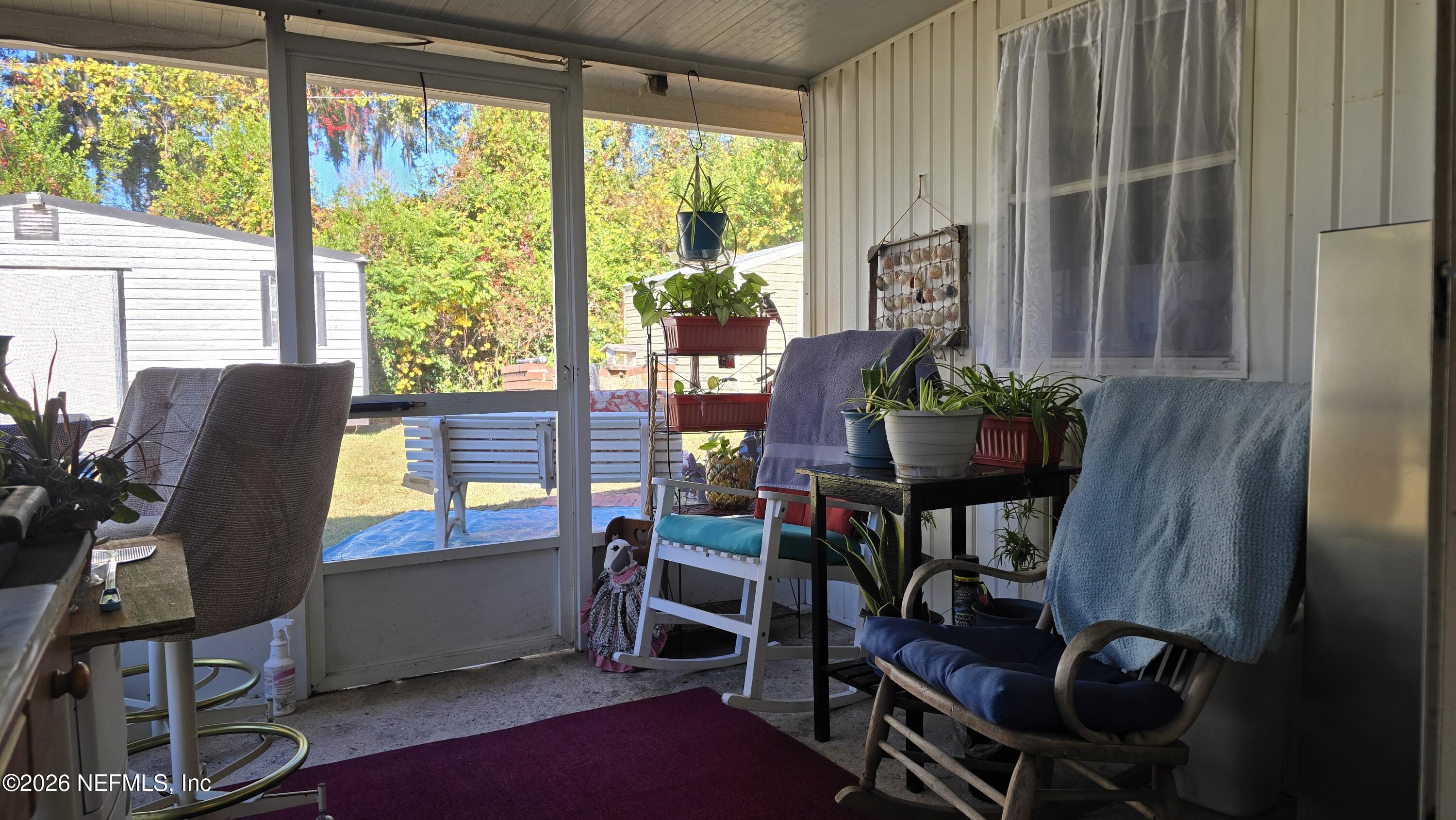367 Southeast Tribble Street Lake City, FL 32025 - Photo 11 of 12 a work room with furniture and large windows