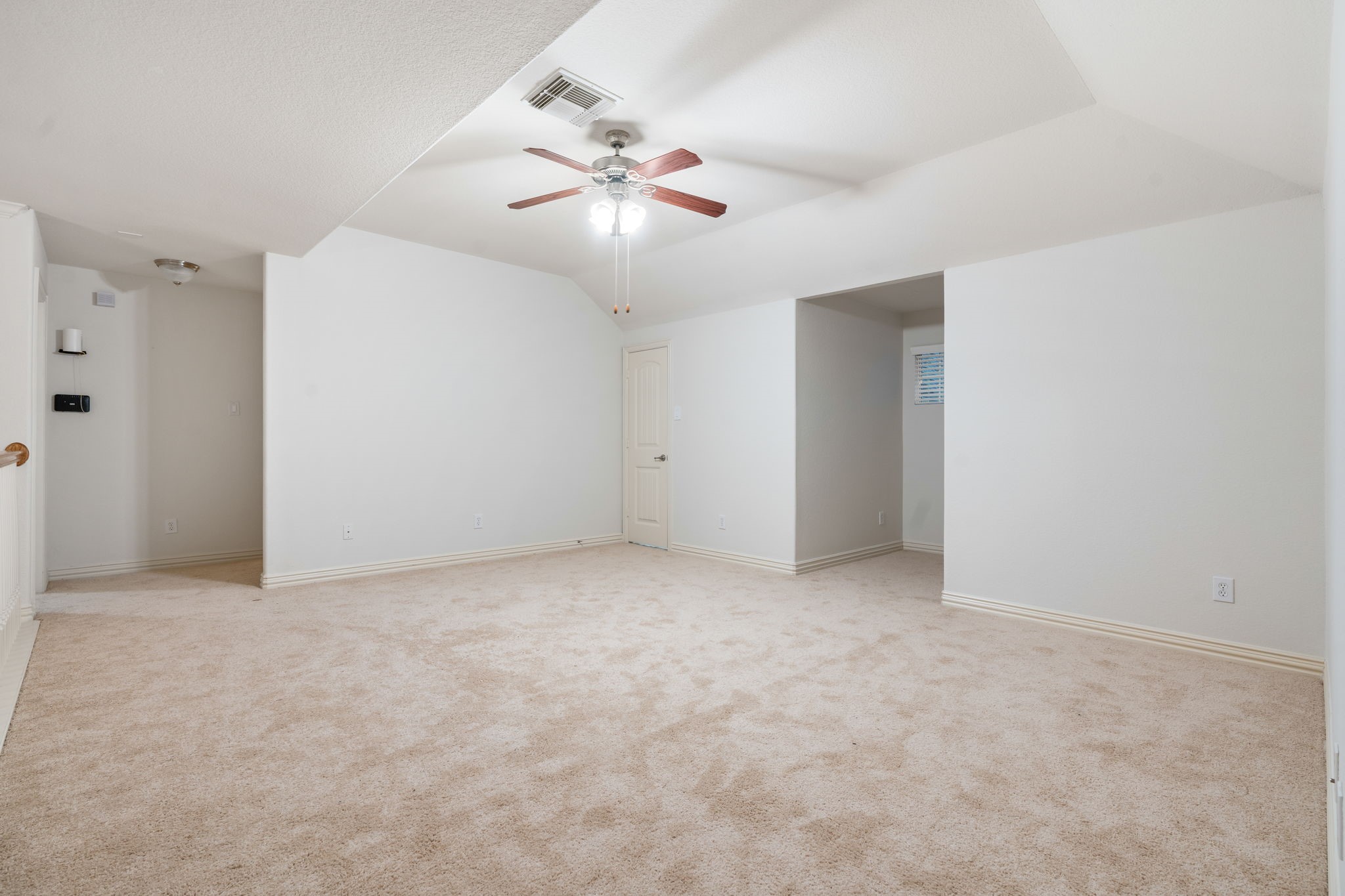 307 Arbor Ridge Lane Conroe, TX 77384 - Photo 26 of 50 an empty room with a chandelier fan and closet
