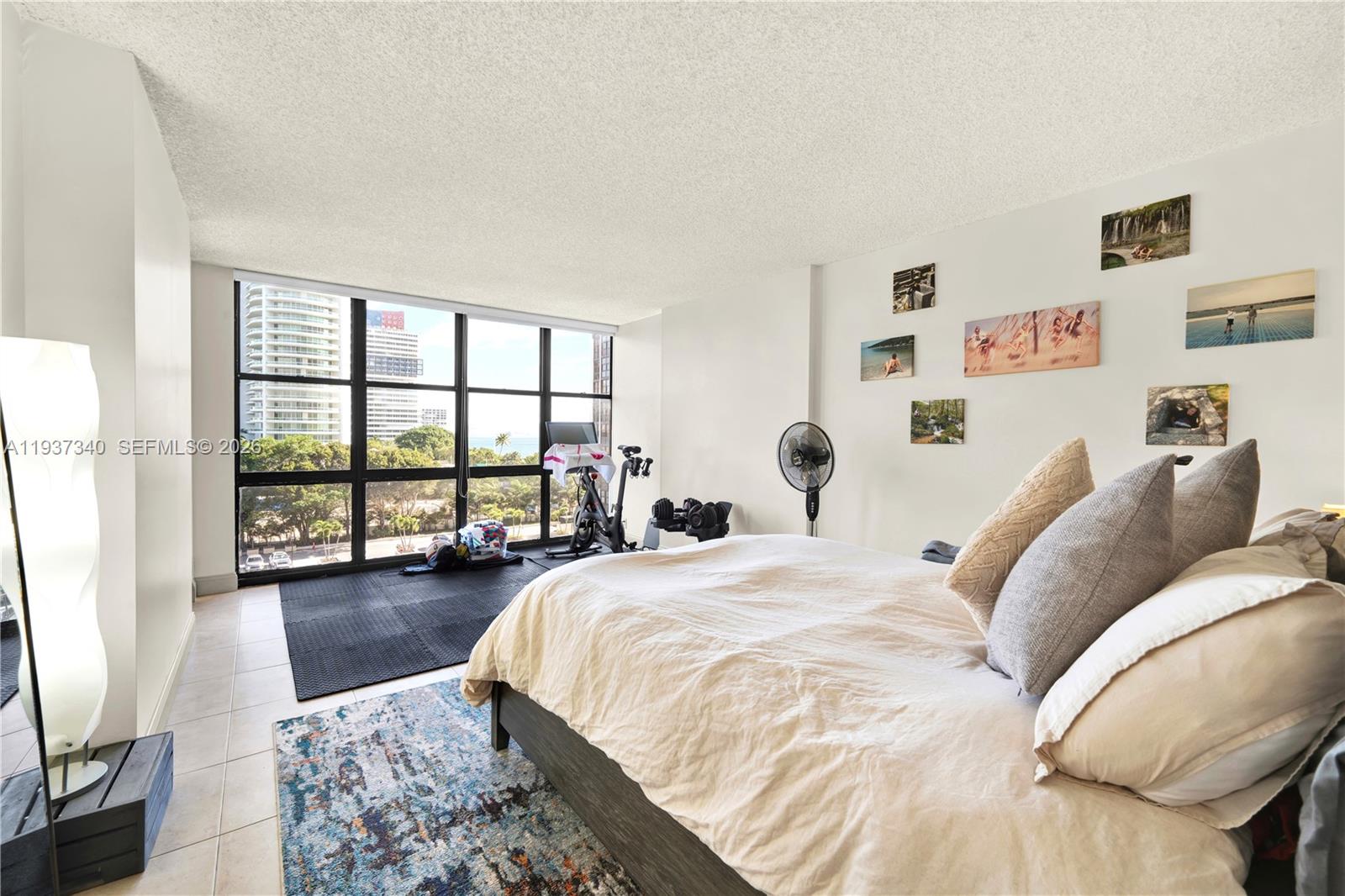 1901 Brickell Avenue, Unit B711 Miami, FL 33129 - Photo 17 of 41 a bedroom with a large bed and a large window