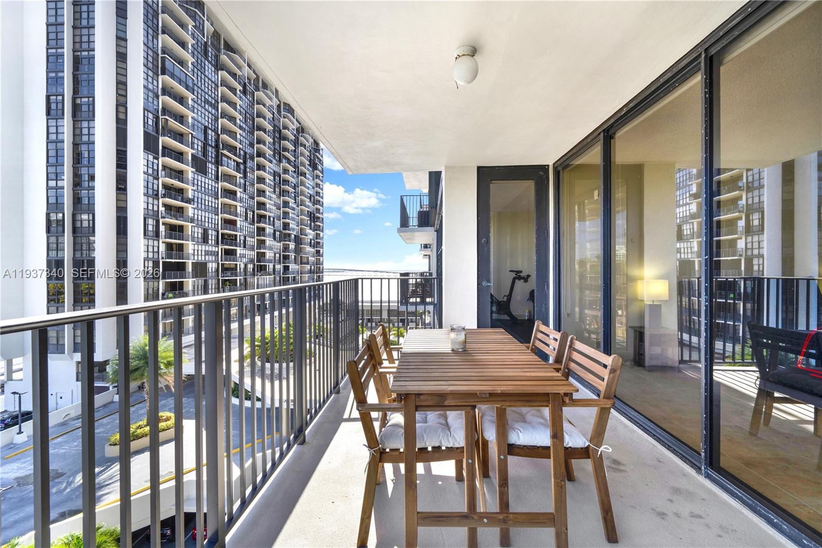 1901 Brickell Avenue, Unit B711 Miami, FL 33129 - Photo 23 of 41 a view of a balcony dining table and chairs