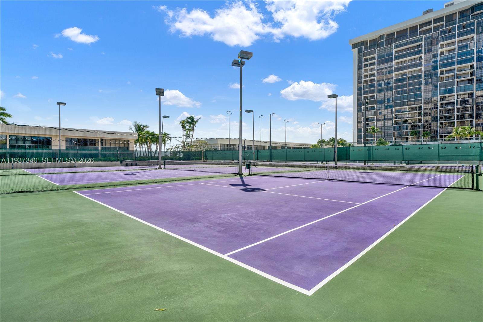 1901 Brickell Avenue, Unit B711 Miami, FL 33129 - Photo 28 of 41 a tennis court that has tall trees