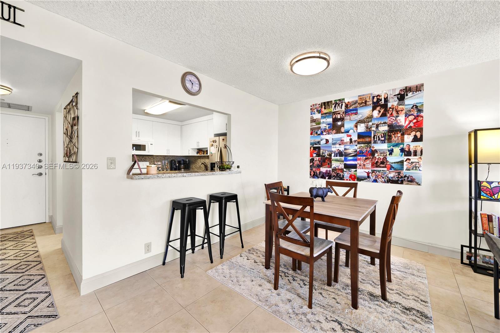 1901 Brickell Avenue, Unit B711 Miami, FL 33129 - Photo 7 of 41 a view of a dining room with furniture and chandelier