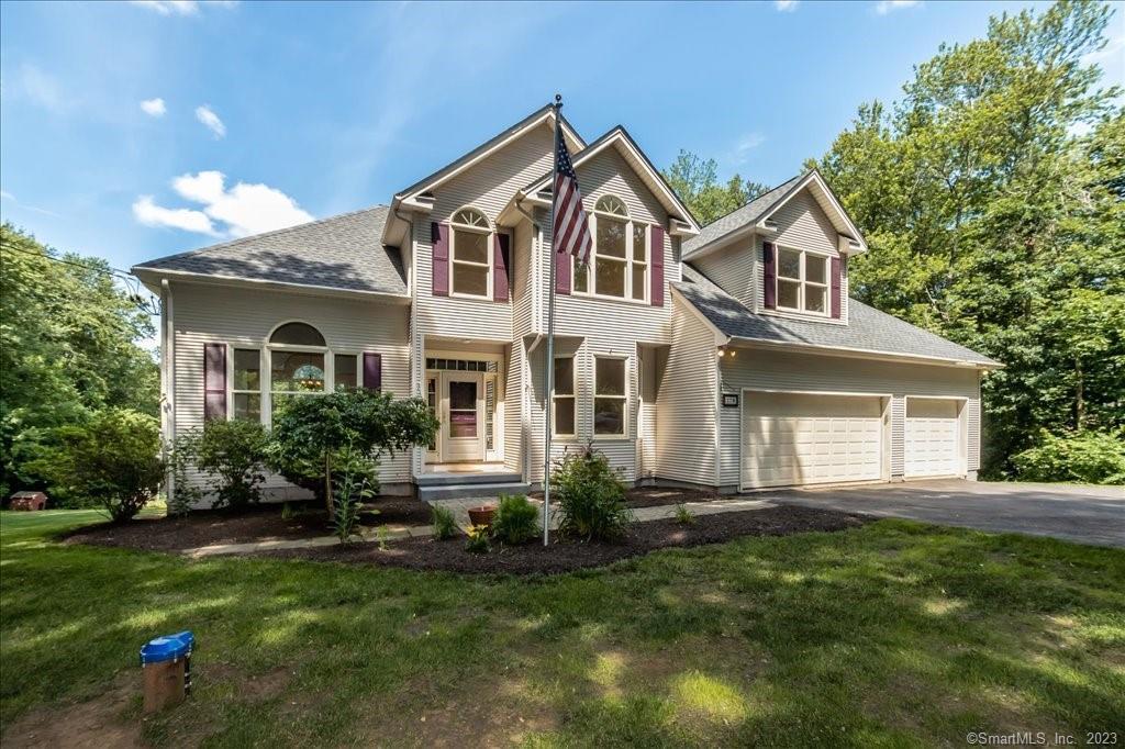 779 Newgate Road Suffield, CT 06093 - Photo 1 of 1 a front view of a house with a yard and potted plants