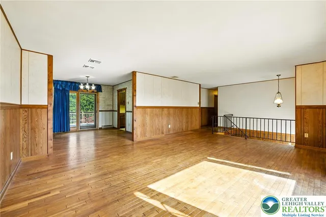 a view of a livingroom with wooden floor