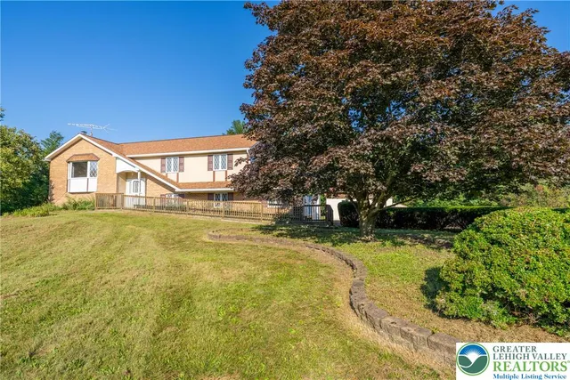 a view of swimming pool with an outdoor space and seating area