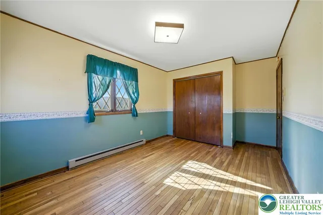 a view of empty room with a fireplace