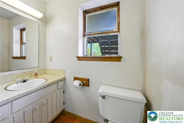 a view of a room with wooden walls