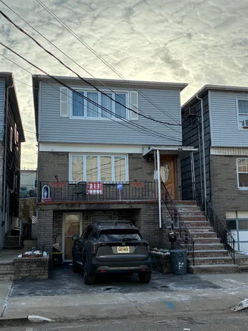 a front view of a house with parking