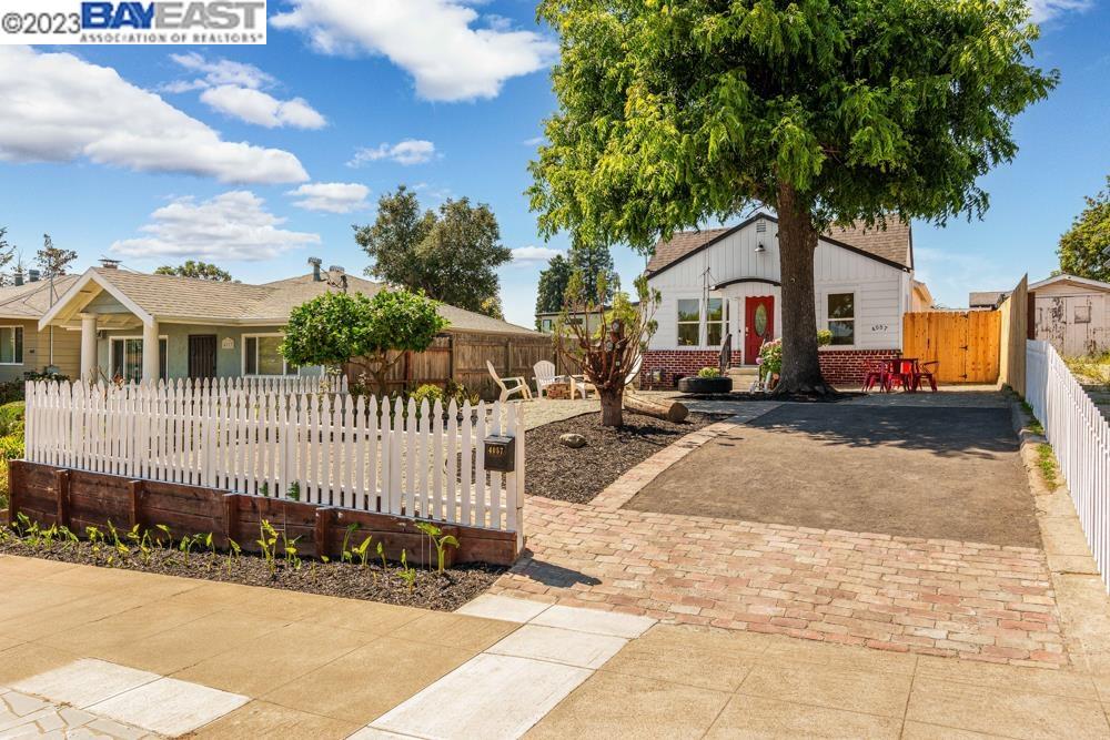 4057 Maple Avenue Oakland, CA 94602 - Photo 1 of 1 a front view of a house with a garden