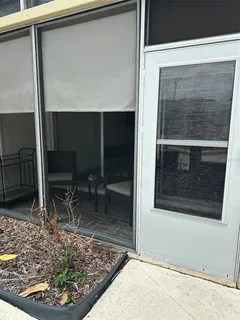 a view of a patio with swimming pool table and chairs