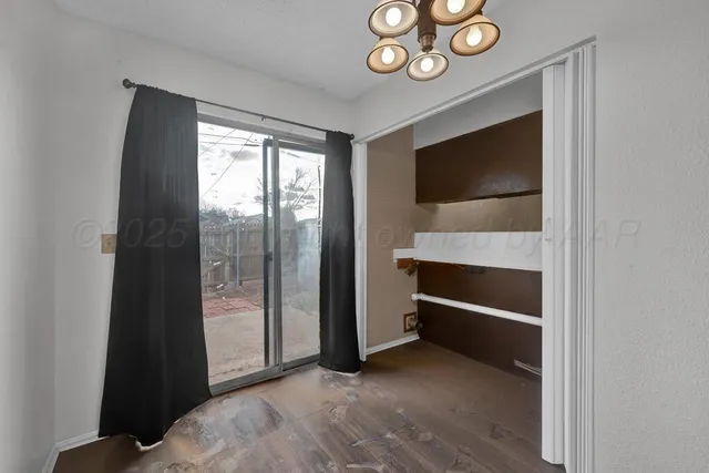 a bathroom with a granite countertop sink toilet a mirror and shower