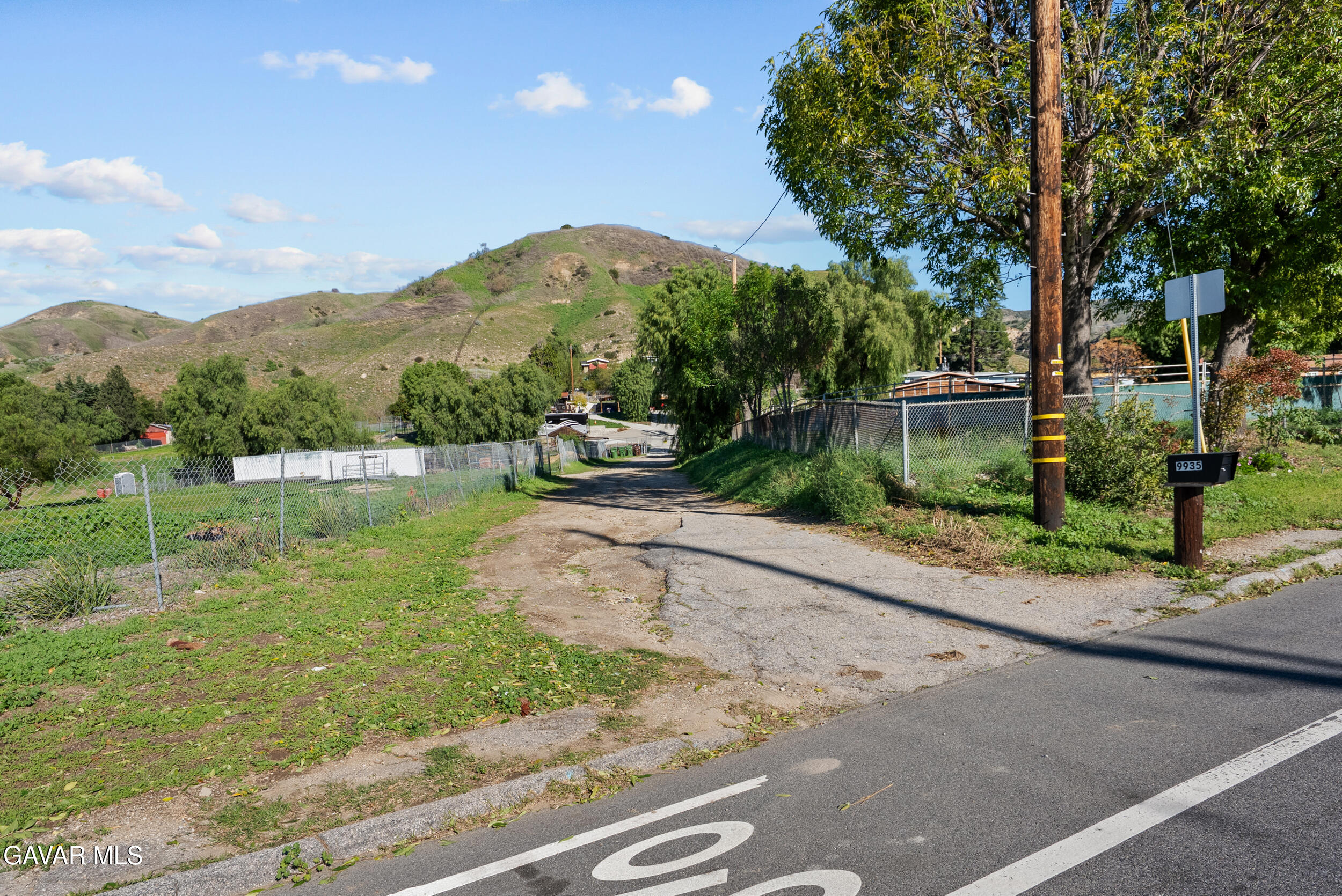 0 Foothill Boulevard Sylmar, CA 91342 - Photo 23 of 32 a view of a garden with a bench under an umbrella