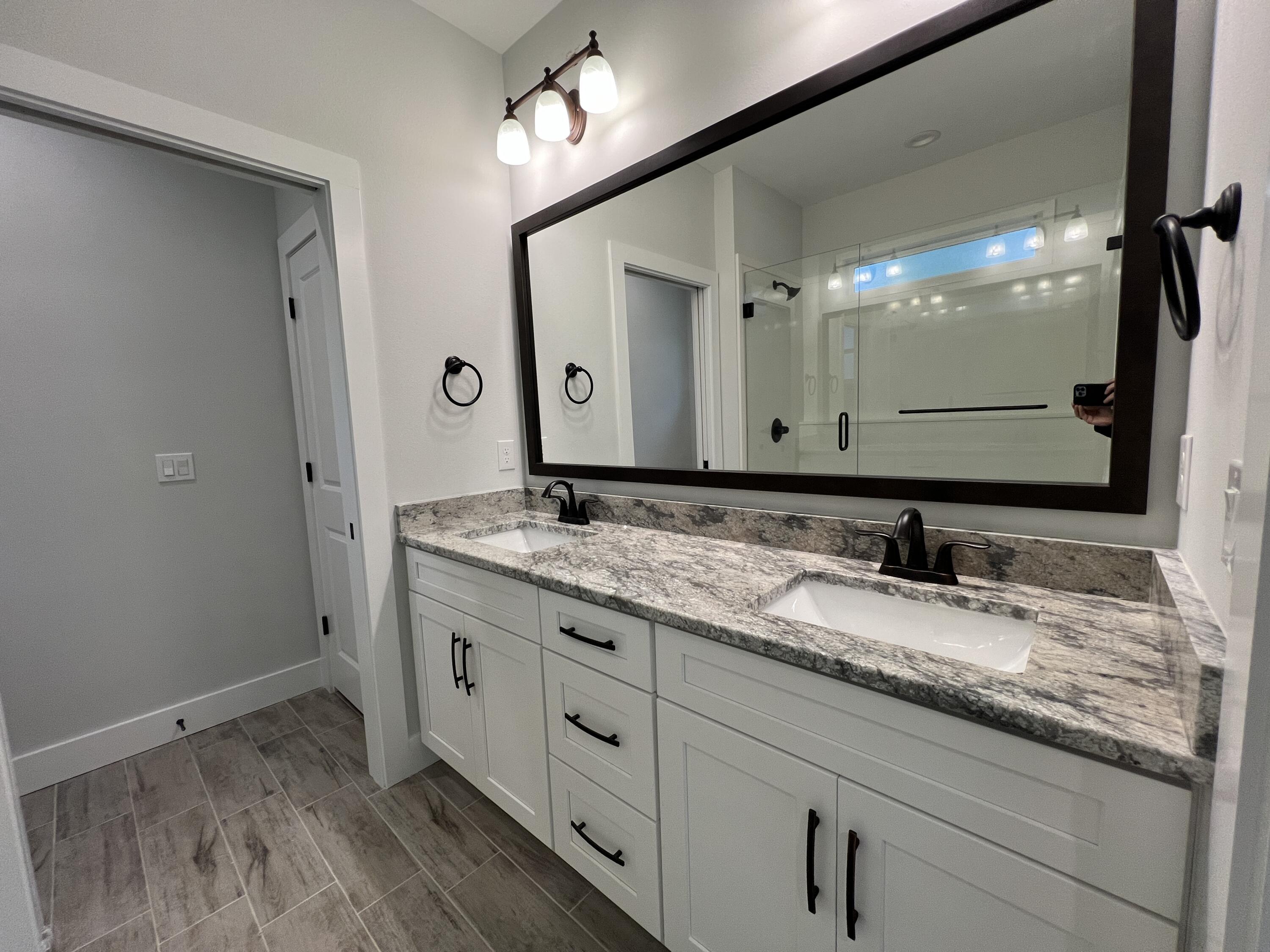 1491 Cat-Mar Road Niceville, FL 32578 - Photo 16 of 30 a bathroom with a granite countertop sink double and mirror