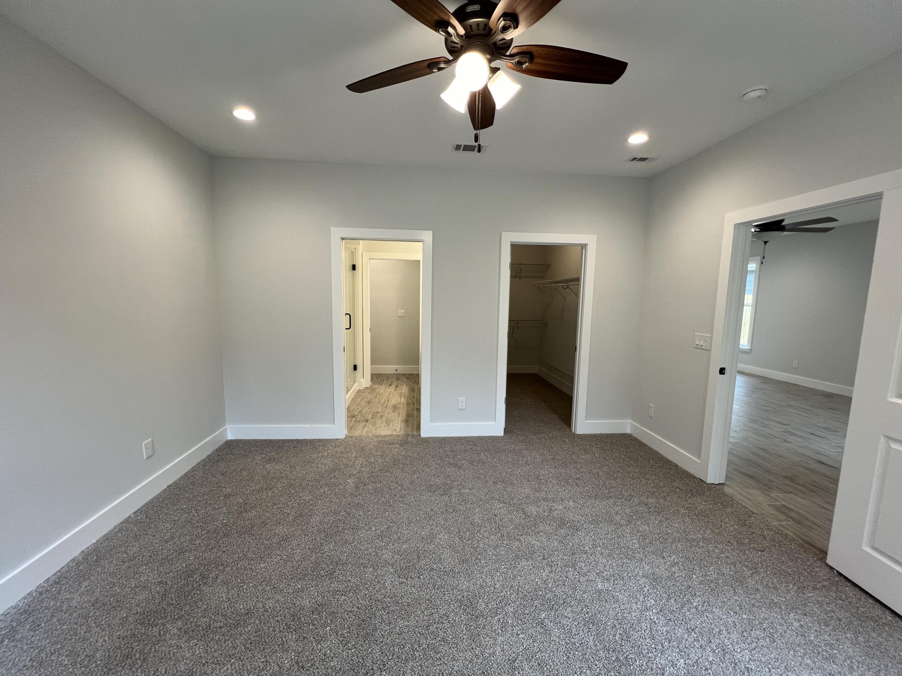 1491 Cat-Mar Road Niceville, FL 32578 - Photo 17 of 30 an empty room with closet and a ceiling fan